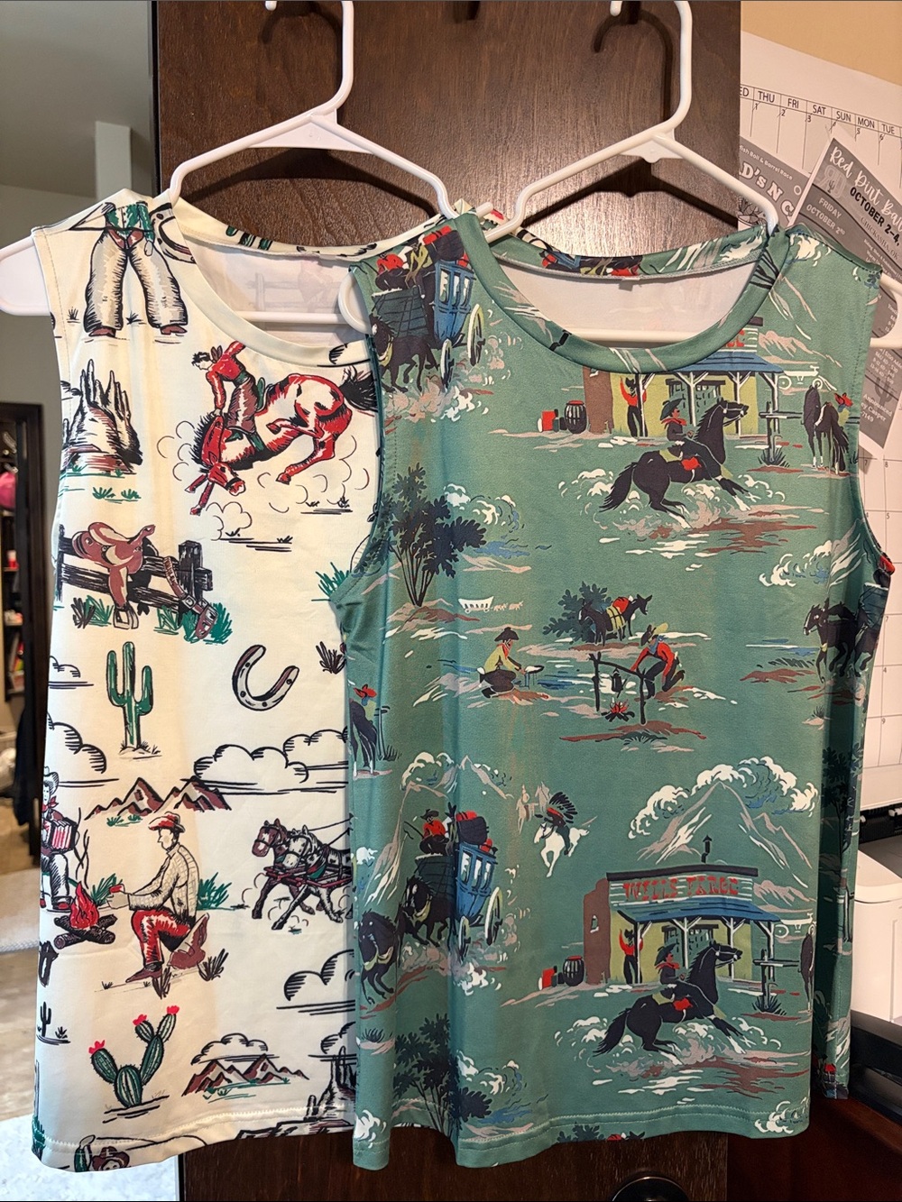 Cowboy print sleeveless shirts.  Get 2 for price of 1 size medium